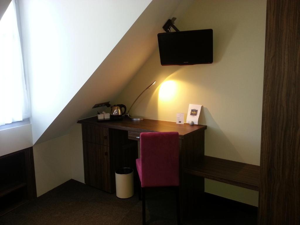 TV a/nebo společenská místnost v ubytování Hotel Vauban