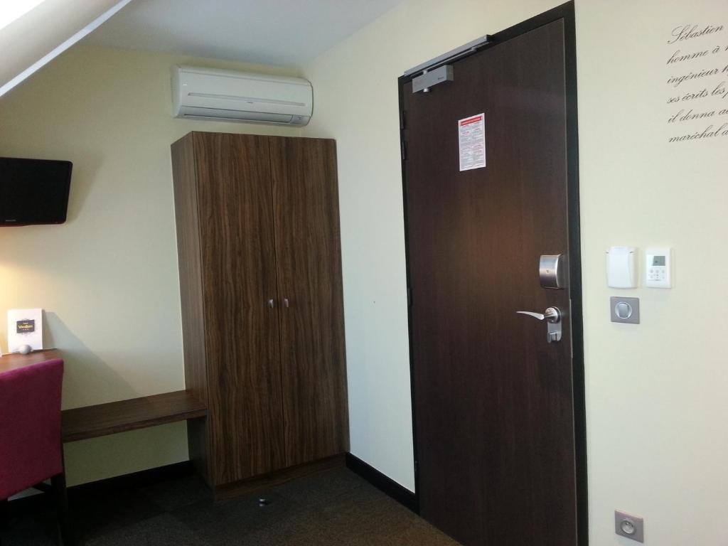 TV a/nebo společenská místnost v ubytování Hotel Vauban