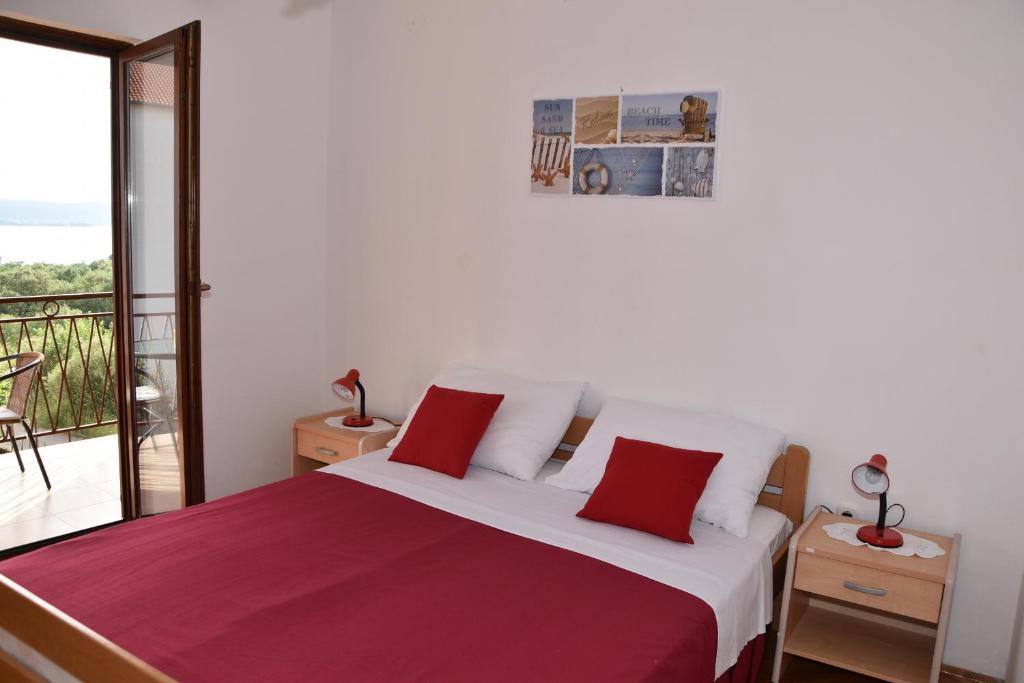 Postel nebo postele na pokoji v ubytování Apartmani Bošana