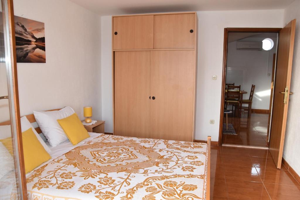 Postel nebo postele na pokoji v ubytování Apartmani Bošana