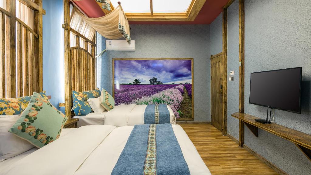 TV a/nebo společenská místnost v ubytování Floral Hotel · Baihui Living Zhangjiajie