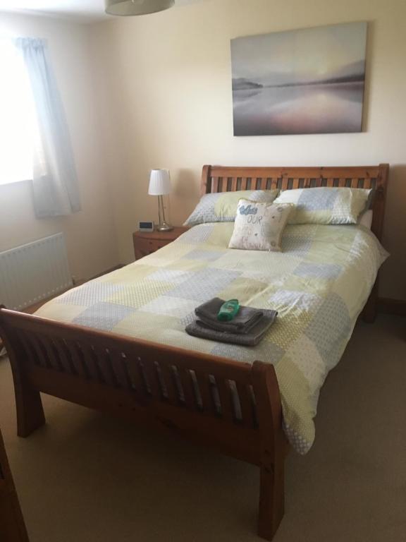 a bedroom with a bed with a tray on it at Portstewart - holiday let in Portstewart