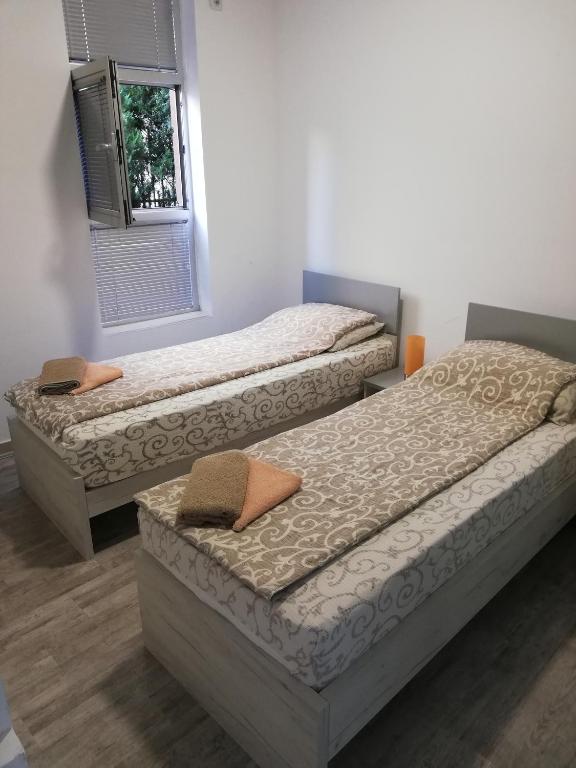 Postel nebo postele na pokoji v ubytování Athos Apartments