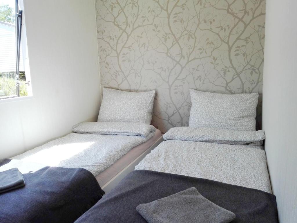 Postel nebo postele na pokoji v ubytování Mobilní dům Marbella kemp Výrovice