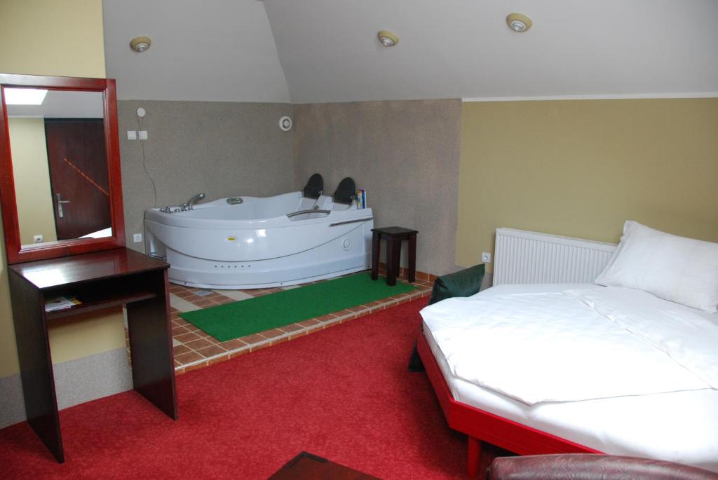 Krevet ili kreveti u jedinici u okviru objekta HOTEL VILA MITIC LUXX SPA centar