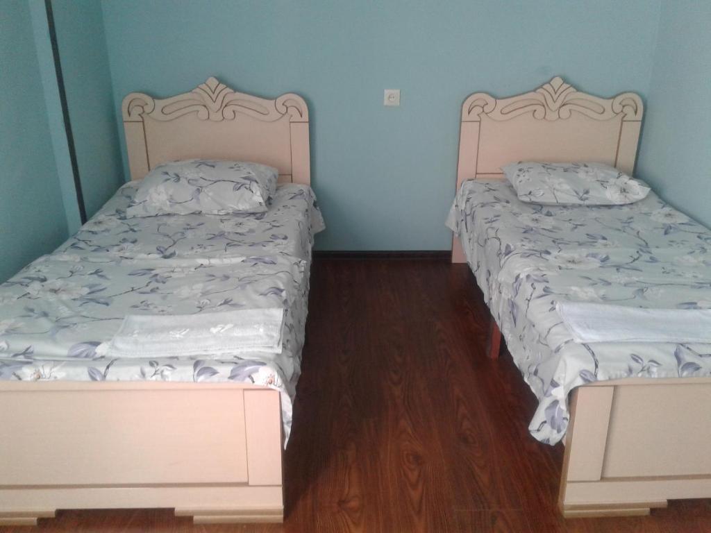 Postel nebo postele na pokoji v ubytování Guest Houze Nona
