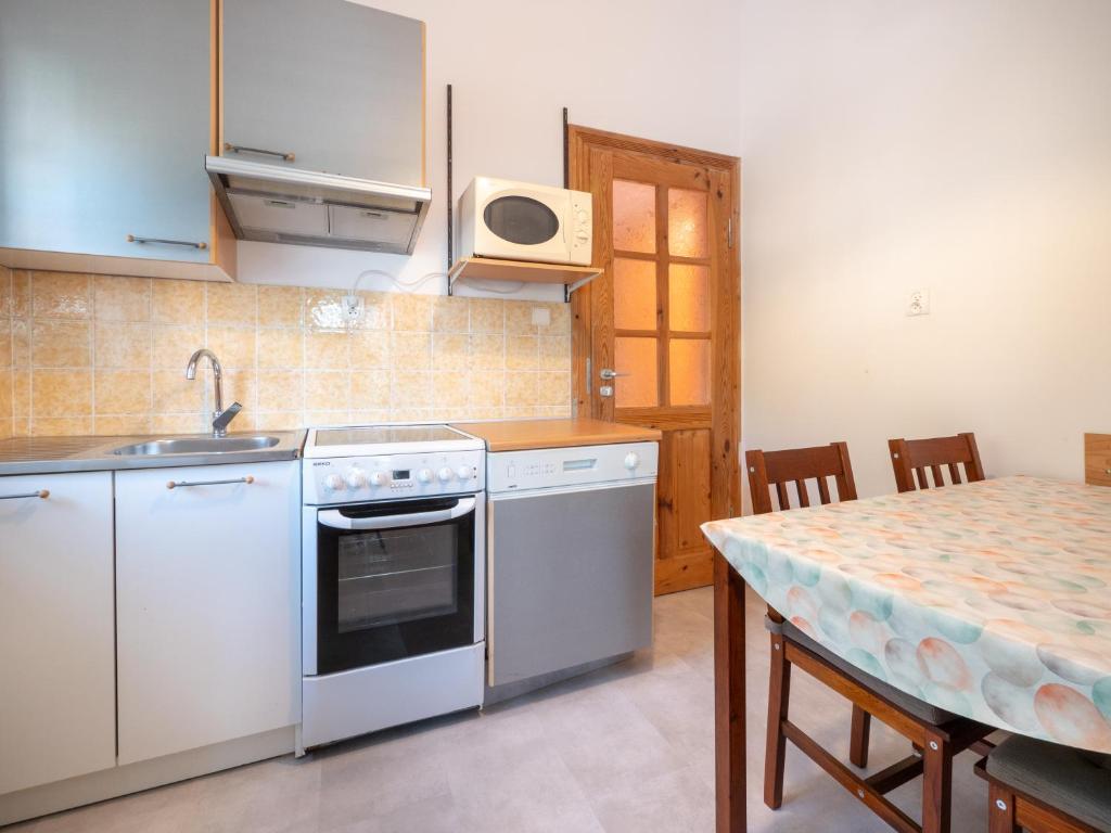 Kuchyň nebo kuchyňský kout v ubytování Apartamenty Maria