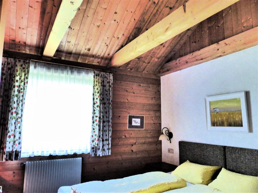 Postel nebo postele na pokoji v ubytování Hotel Garni Zerzer
