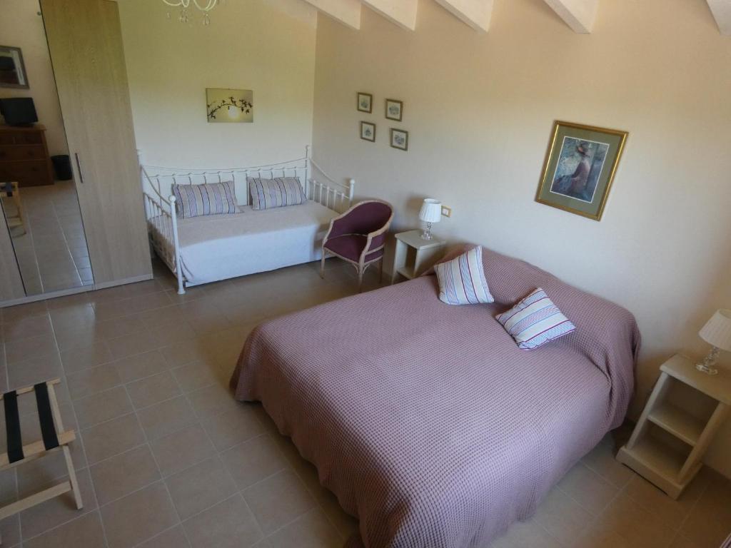 Łóżko lub łóżka w pokoju w obiekcie Il Frutteto Bed and Breakfast