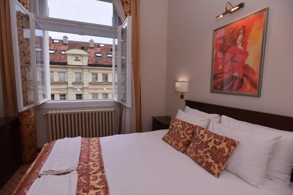 Ένα ή περισσότερα κρεβάτια σε δωμάτιο στο Hotel Beograd