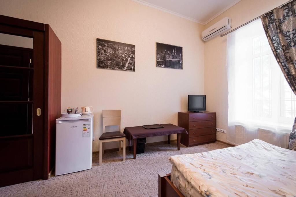 Postel nebo postele na pokoji v ubytování Apart-Hotel next to Deribasivska