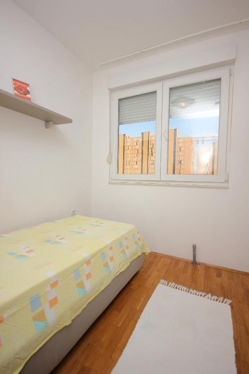 Posteľ alebo postele v izbe v ubytovaní Apartment Karlo near the most beautiful beach Žnjan