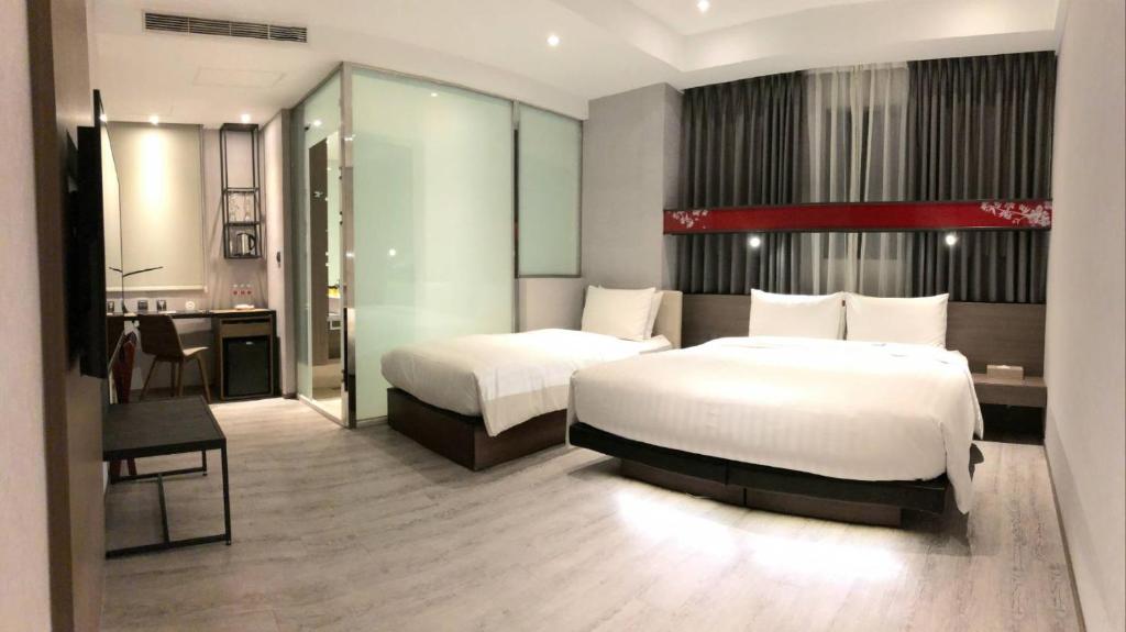 Postel nebo postele na pokoji v ubytování City Place Hotel