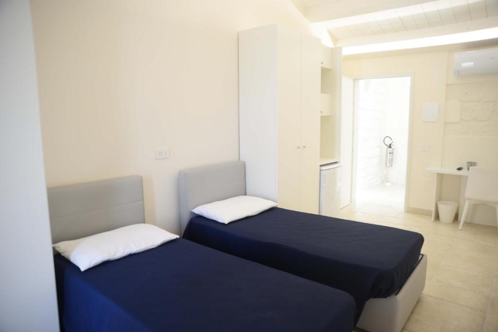 Postel nebo postele na pokoji v ubytování NMCpalace