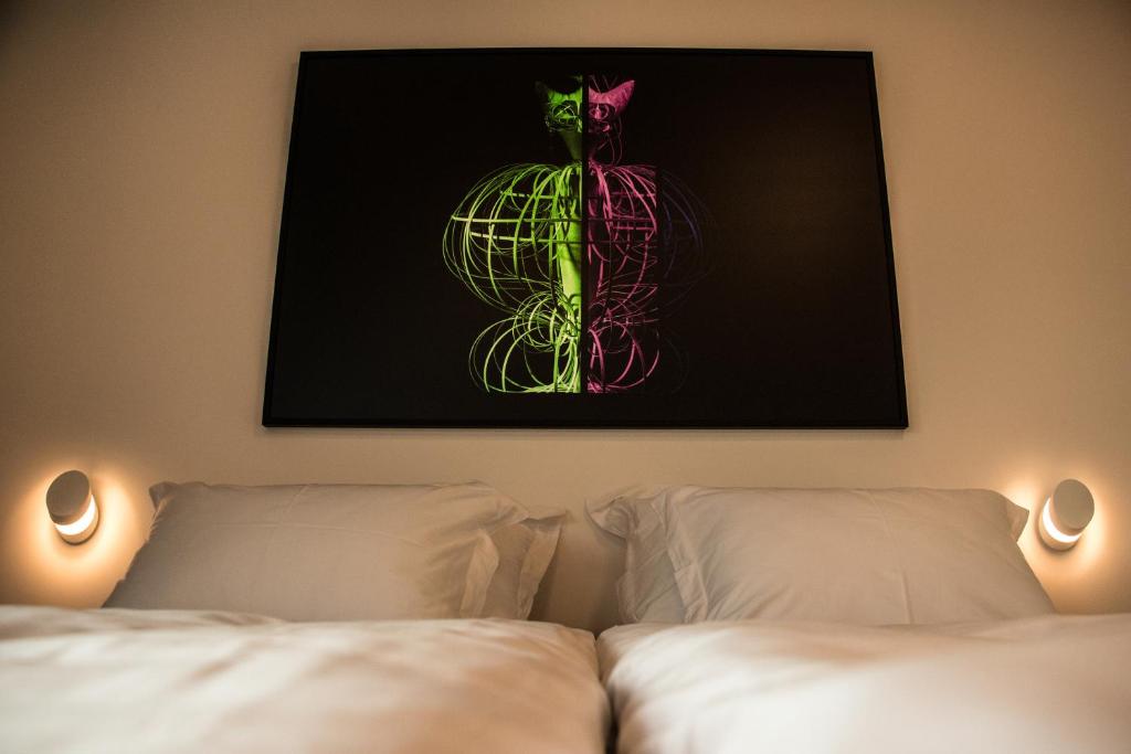Postel nebo postele na pokoji v ubytování WUD hotel