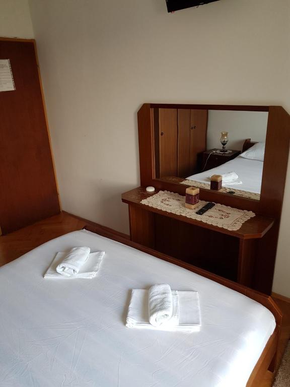 Postel nebo postele na pokoji v ubytování Sobe i apartmani Marović