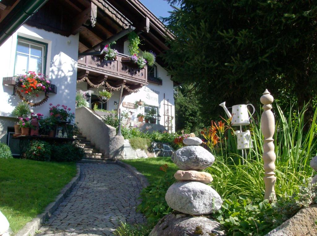 a stone path in front of a house at Landhaus Herzog in Maria Alm am Steinernen Meer
