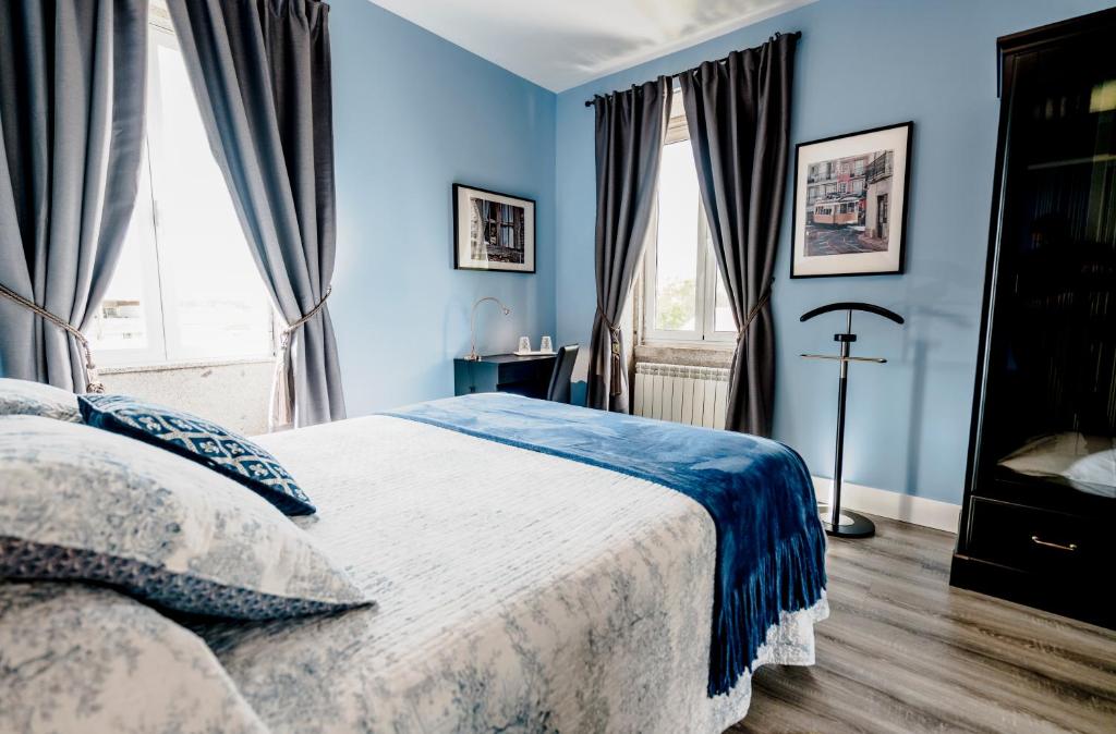 Uma cama ou camas num quarto em Palacete Villa Idalina