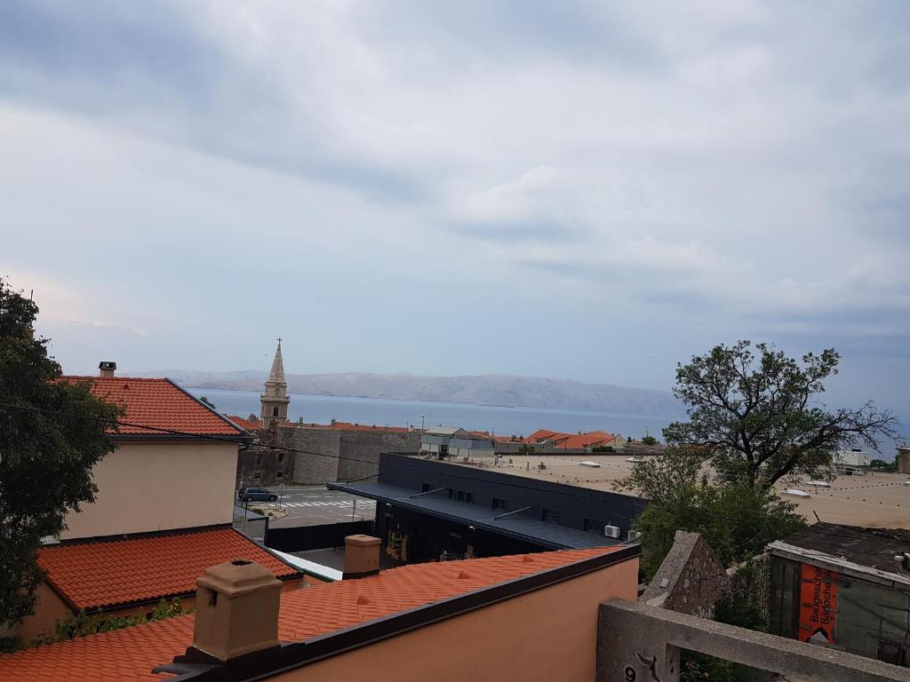 a view of the water from a city with roofs at Apartment Marina in Senj