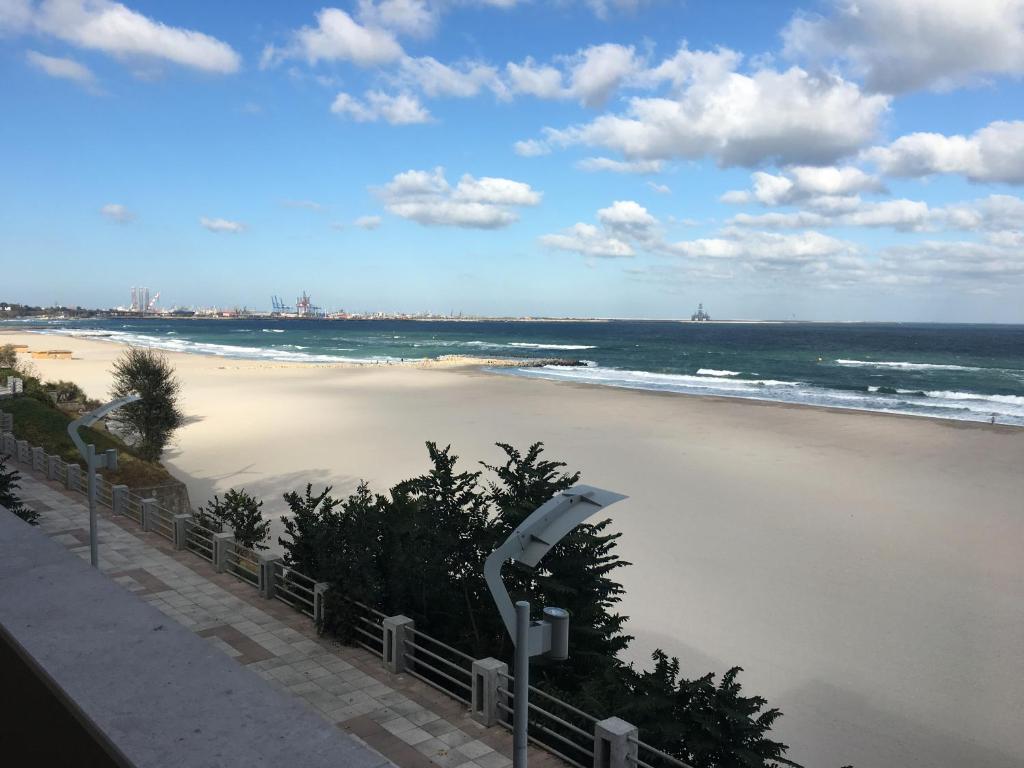 a view of a beach with the ocean at Vila Aquamarine in Eforie Nord