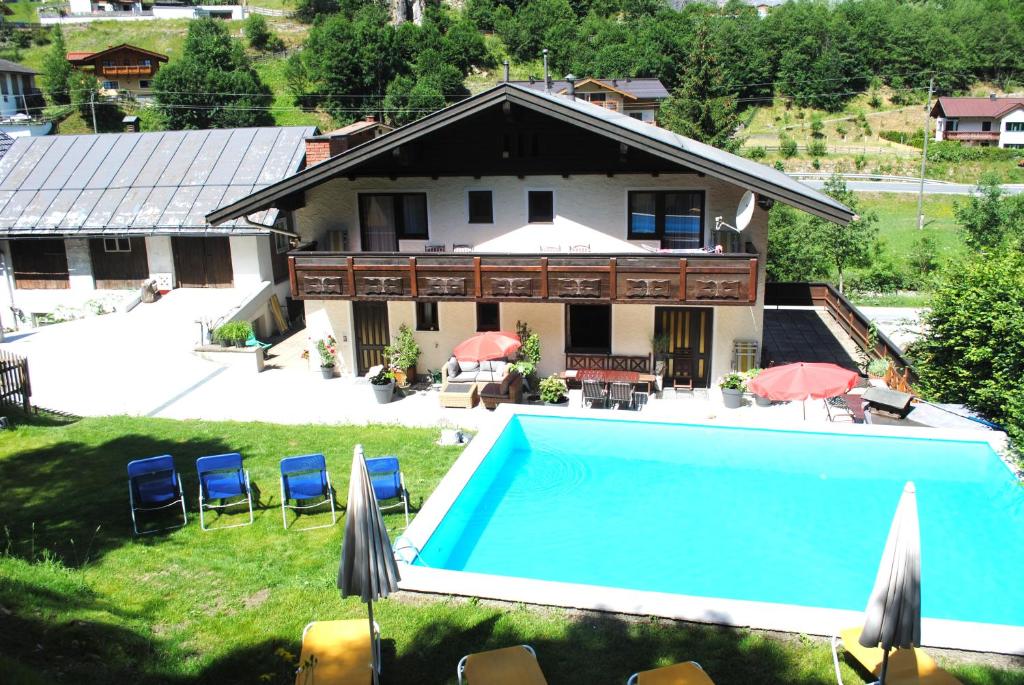 an aerial view of a house with a swimming pool at Naturhaus Andrea in Grossarl