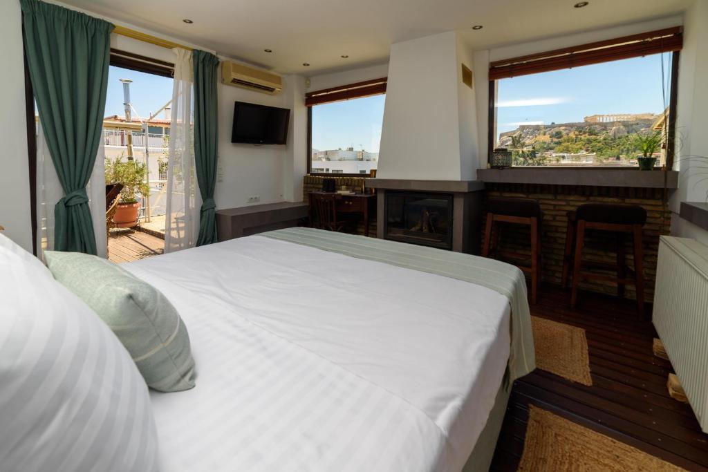 Posteľ alebo postele v izbe v ubytovaní Acropolis Eye Loft