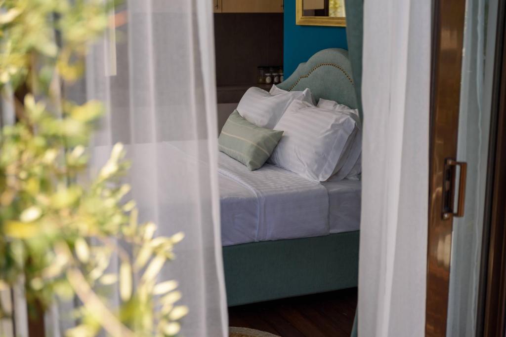 Posteľ alebo postele v izbe v ubytovaní Acropolis Eye Loft