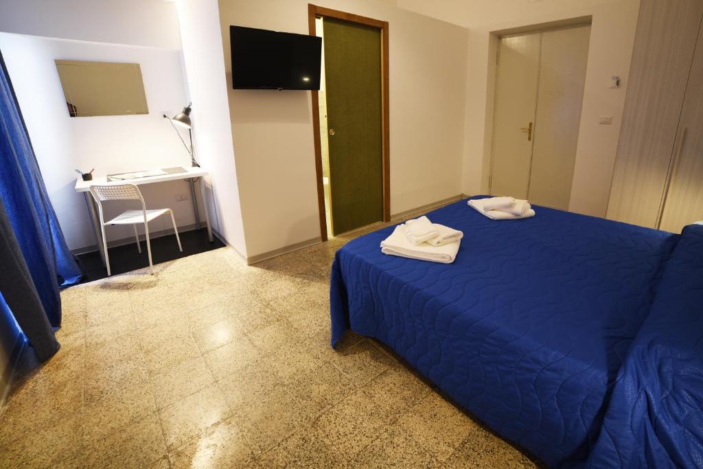 Łóżko lub łóżka w pokoju w obiekcie TIFEO Bed & Breakfast
