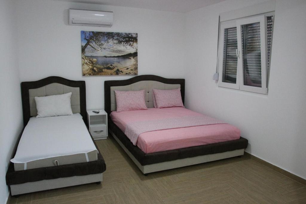 Postel nebo postele na pokoji v ubytování Zigovic Apartmani