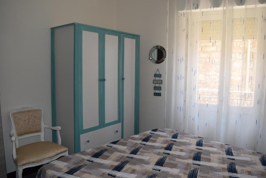 Łóżko lub łóżka w pokoju w obiekcie Tesori di Sardegna