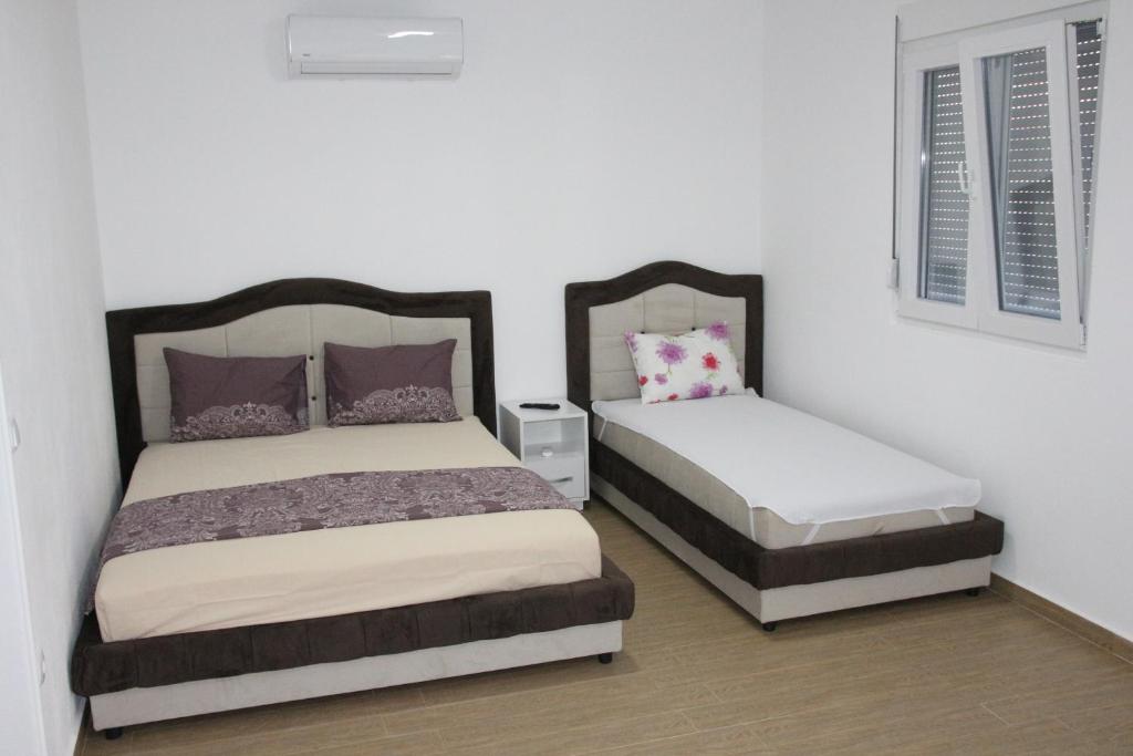 Postel nebo postele na pokoji v ubytování Zigovic Apartmani
