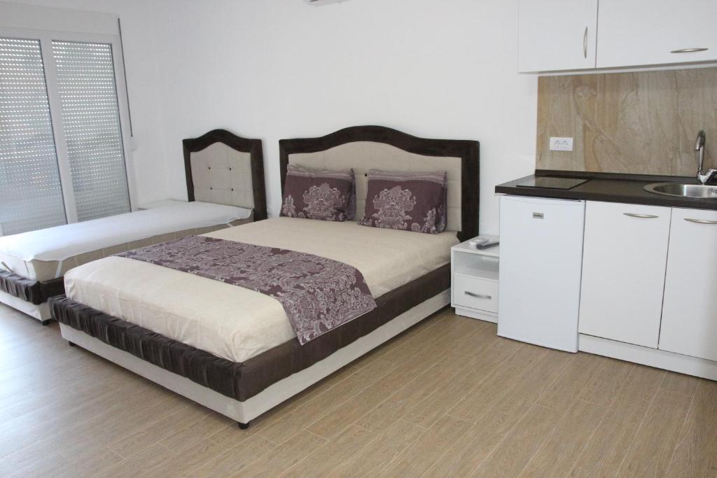 Postel nebo postele na pokoji v ubytování Zigovic Apartmani