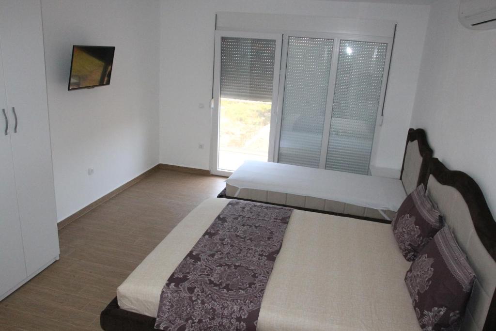 Postel nebo postele na pokoji v ubytování Zigovic Apartmani