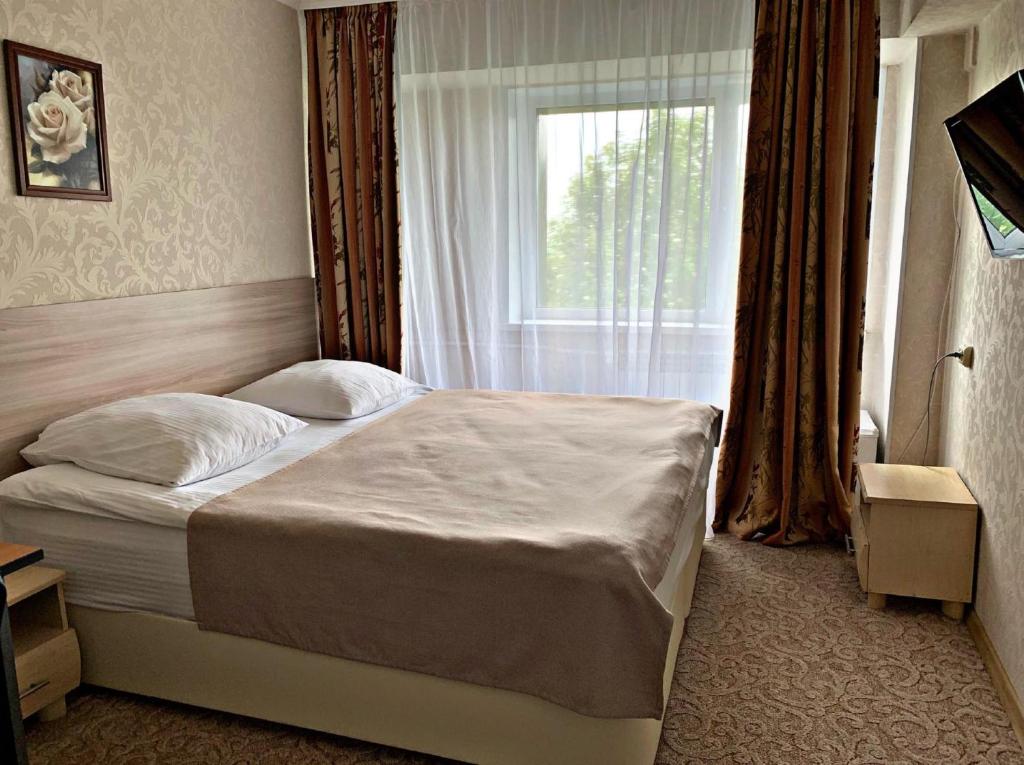 Postelja oz. postelje v sobi nastanitve Geyzer Hotel