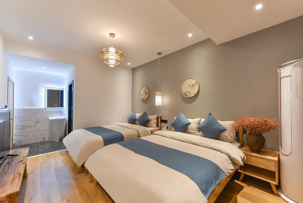 Postel nebo postele na pokoji v ubytování Yifangyan - Tingyuan Qingshe Hostel