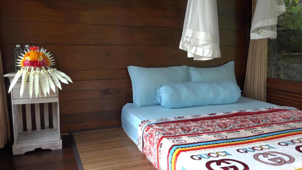 Postel nebo postele na pokoji v ubytování Bali Jungle Resort