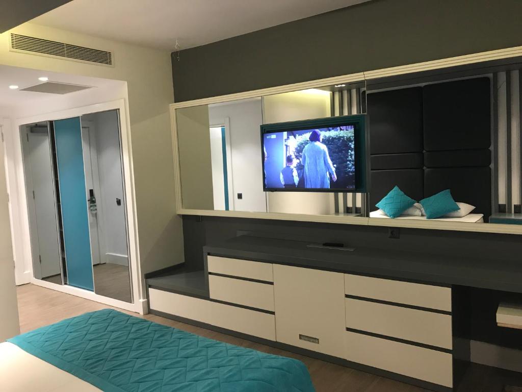 TV a/nebo společenská místnost v ubytování Oyster Boutique Hotel