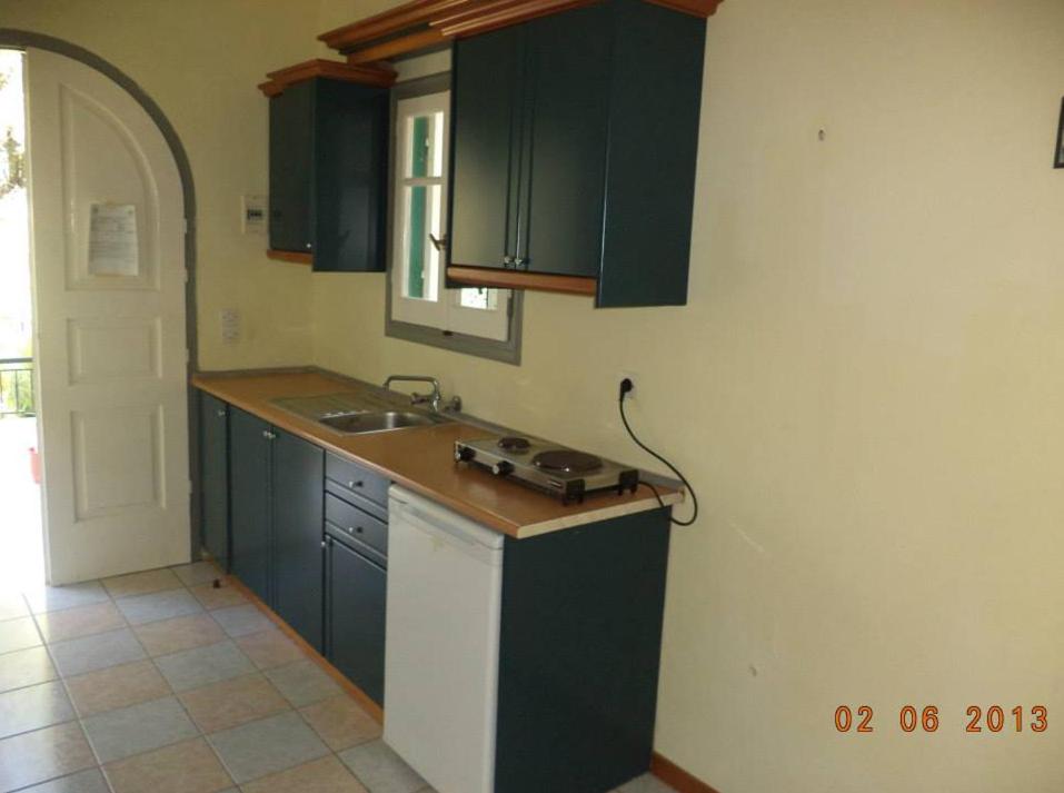 Kuchyňa alebo kuchynka v ubytovaní Rigos Apartments
