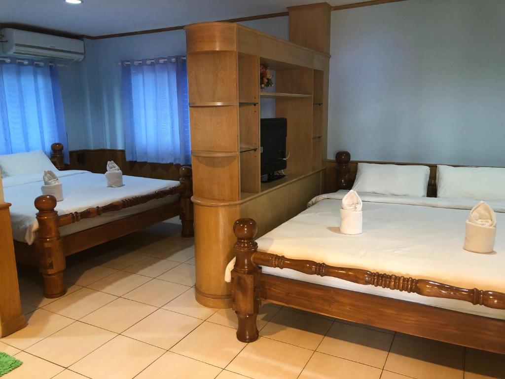 Postel nebo postele na pokoji v ubytování Chiang Rai Park Resort