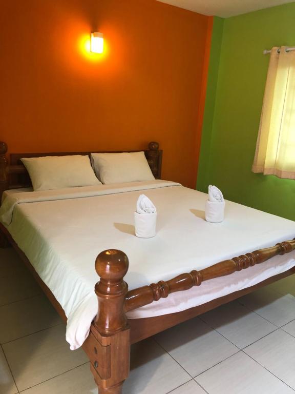 Postel nebo postele na pokoji v ubytování Chiang Rai Park Resort