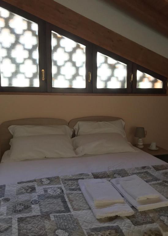 Postel nebo postele na pokoji v ubytování B&B "al Pesce Vela"