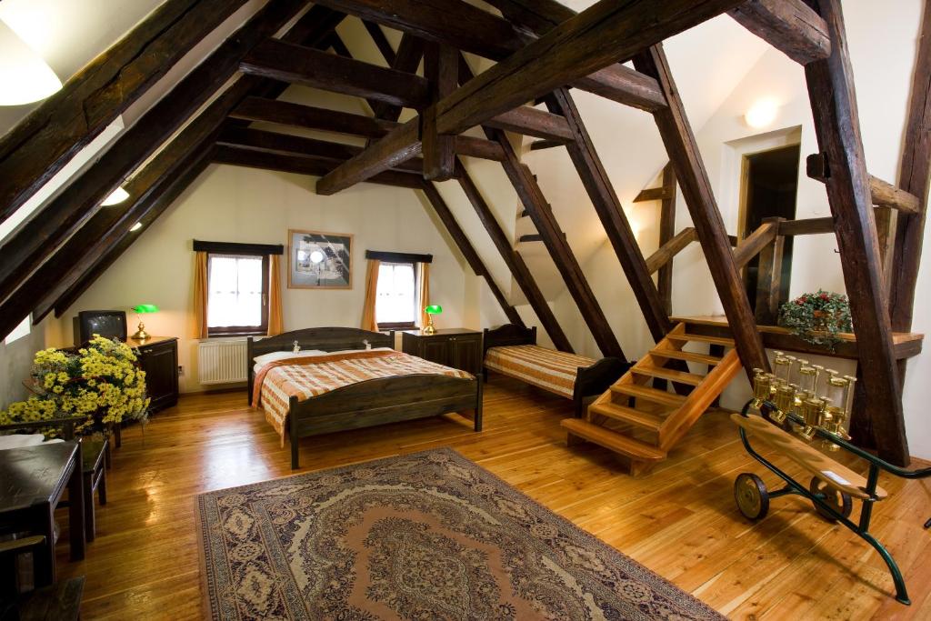 Postel nebo postele na pokoji v ubytování U Medvidku-Brewery Hotel