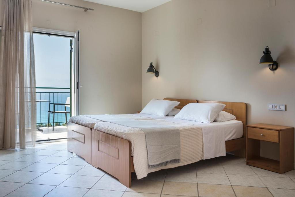 Postel nebo postele na pokoji v ubytování Antonia Hotel