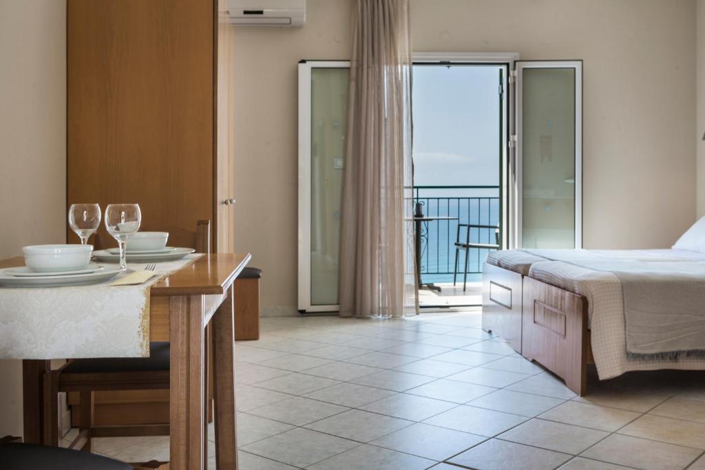 Postel nebo postele na pokoji v ubytování Antonia Hotel