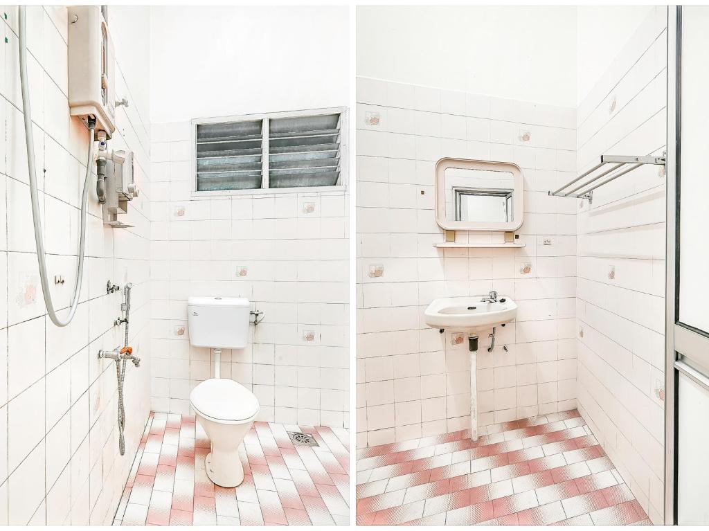 a bathroom with a toilet and a sink at D' Anjung Inn in Tangkak