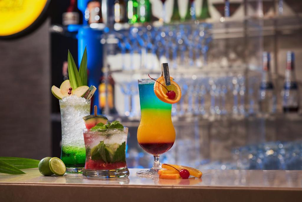two cocktails sitting on a counter in a bar at The Berkeley Hotel Pratunam in Bangkok