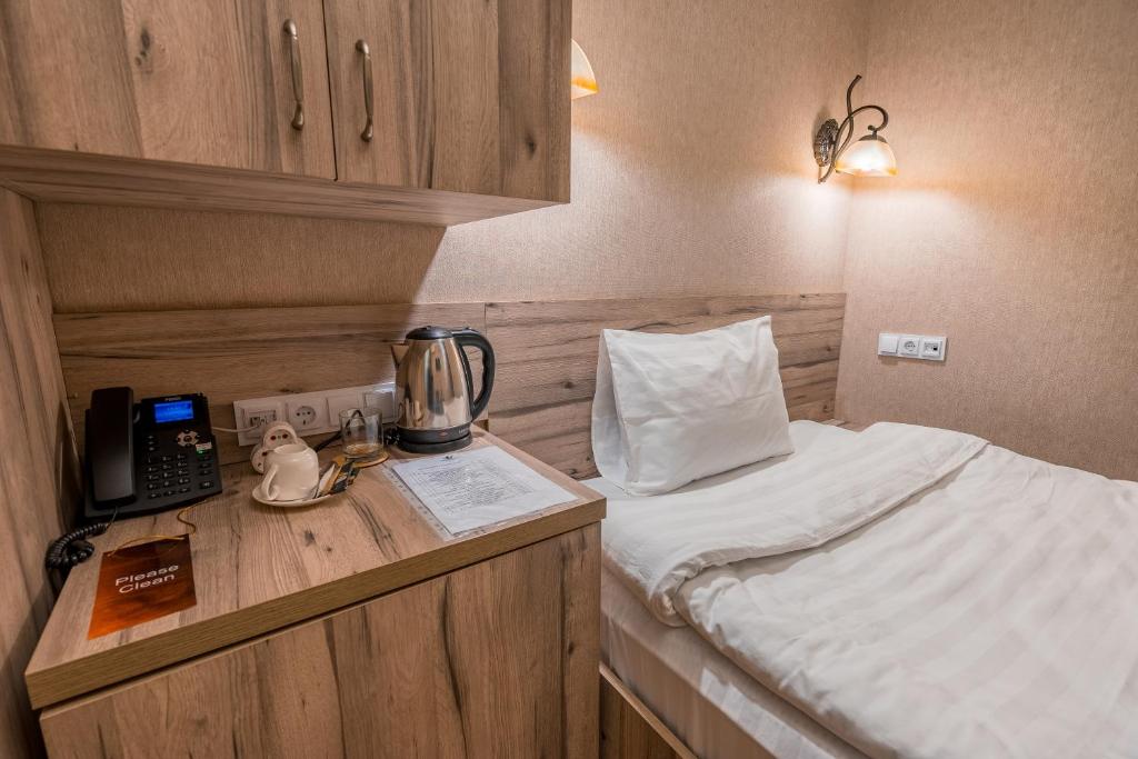 Postel nebo postele na pokoji v ubytování Hotel Imperial House