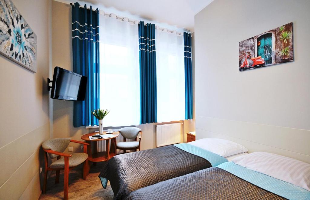 Postel nebo postele na pokoji v ubytování Sanatorium Willa Fortuna
