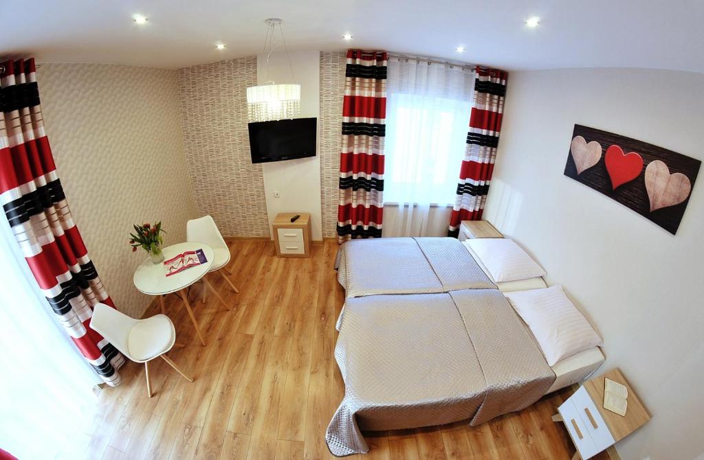 Postel nebo postele na pokoji v ubytování Sanatorium Willa Fortuna