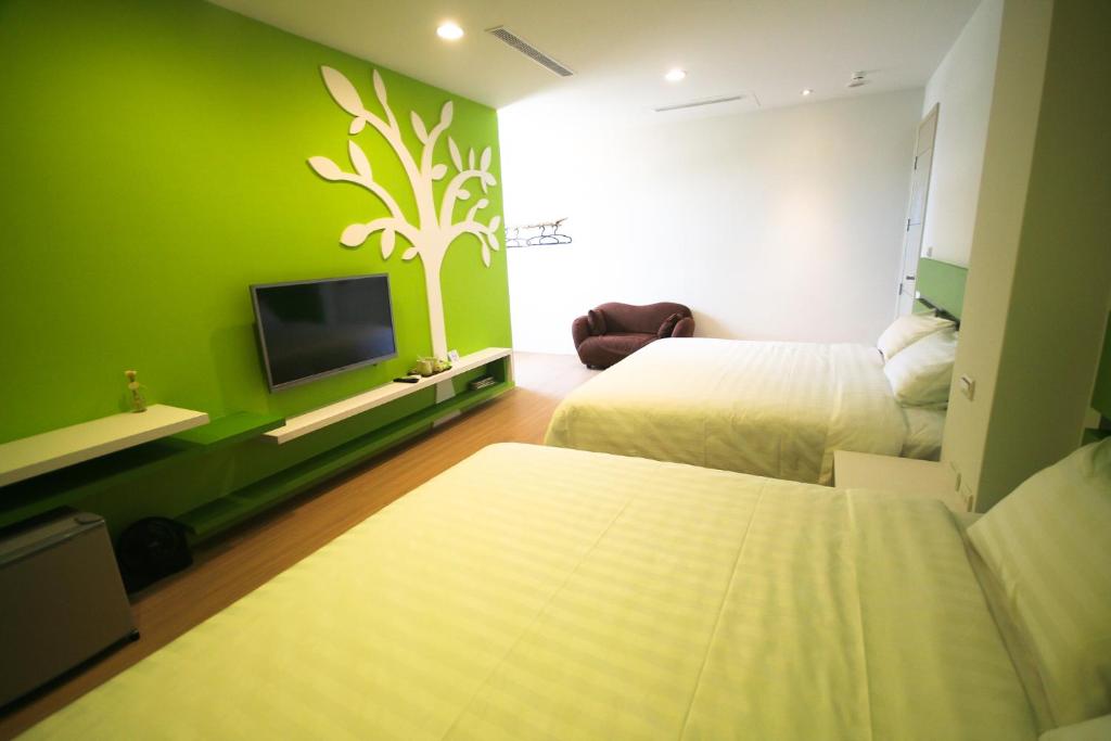Postel nebo postele na pokoji v ubytování Colorful Homestay